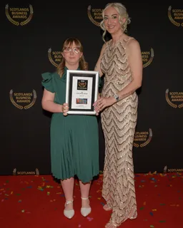 Rise and Dine collecting a 2026 Scotland's Business Awards certificate